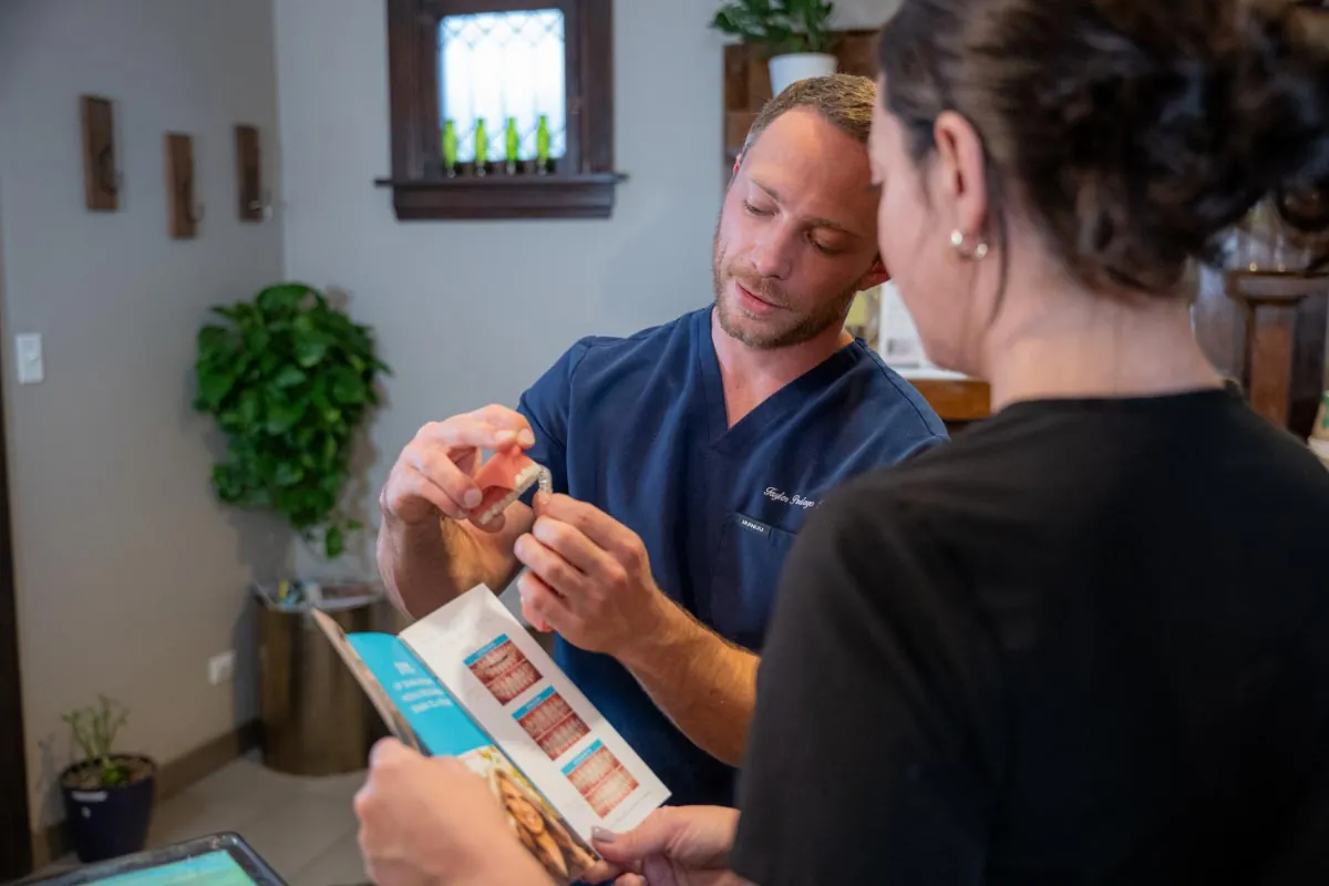 Dr. Pedego showing patient how clear aligners work